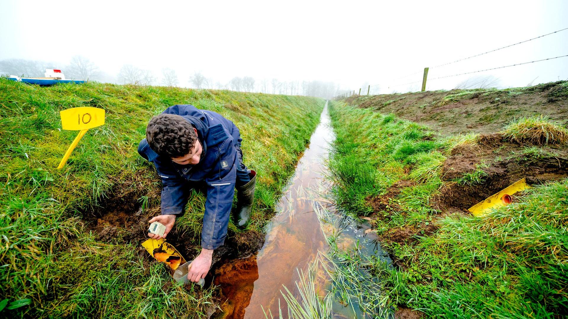 Taking samples from ditch-water near farms to measure nitrate levels