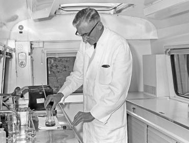 Mr Prins investigates samples in the sample and monitoring unit 1960